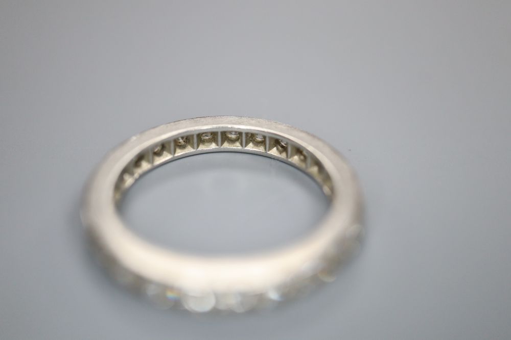 A diamond and white metal full eternity ring, finger size M